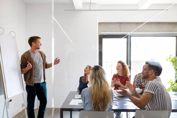 istock Successful group of designers, business people at work in office 1282881729