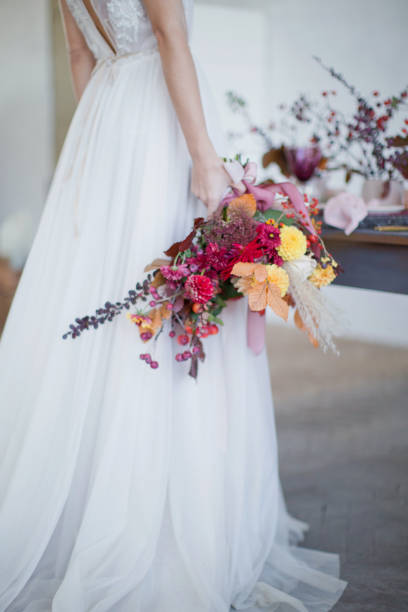 istock Bride with colorful autumn bouquet 1282882232