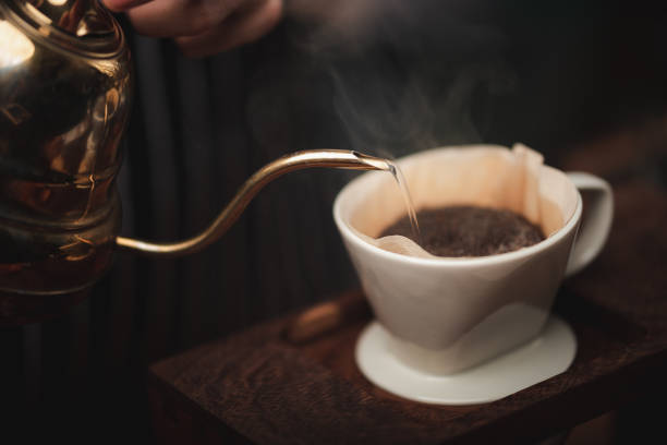 istock Hand drip coffee filter, barista pouring hot water on roasted coffee ground with filter 1282883616