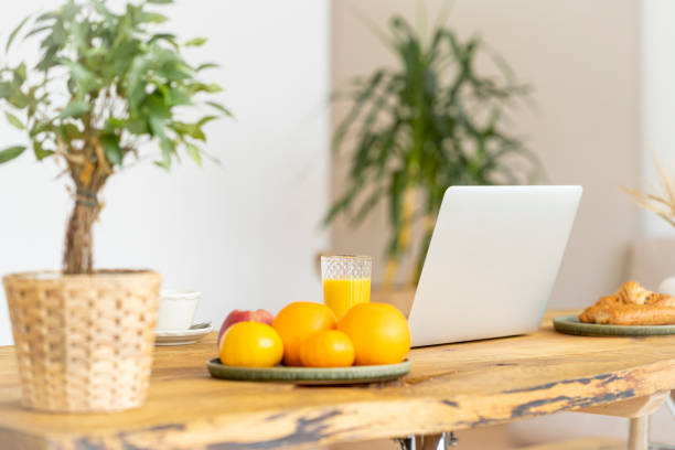 istock Morning routine with breakfast, freelance desktop and laptop. Distance education. Quarantine, self-isolation 1282884636