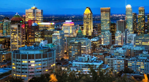 istock Downtown Montreal panoramic view at night featuring skyscrapers at blue hour 1282885214