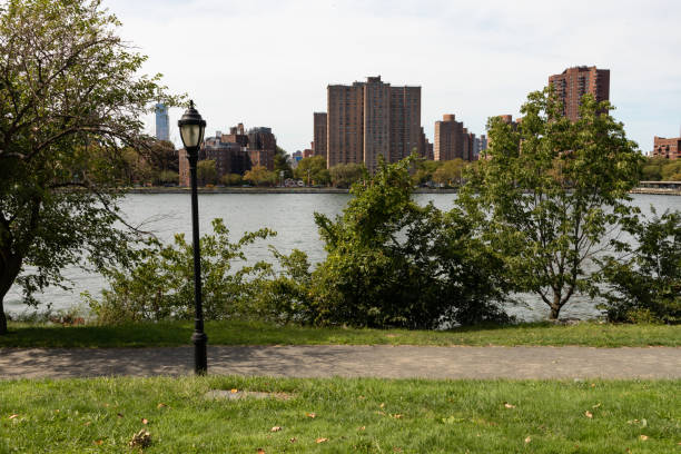 istock Randalls and Wards Islands Empty Riverfront Trail with the East Harlem Skyline in the Background in New York City 1282885233