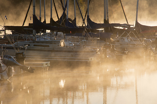 Quakertown, USA - October 14, 2020. Boats on lake at marina in Nockamixon State Park in Autumn, Pennsylvania, USA