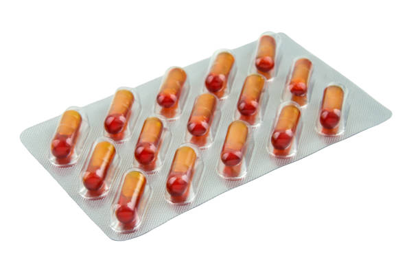 istock Curcuma Capsules isolated against white background 1282887476