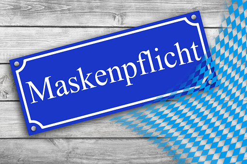 German Face Mask mandatory on blue sign