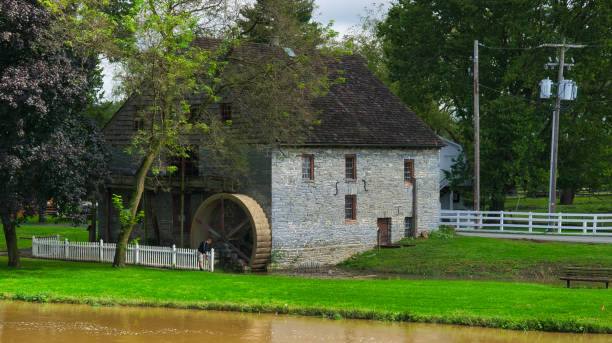 istock Old Water Wheel Grinding Mill Stone Building 1282888896