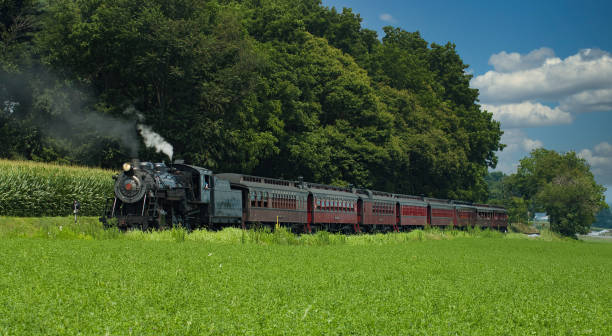 istock Steam Passenger Train Waiting to Pull out of Small Countryside Station 1282888948