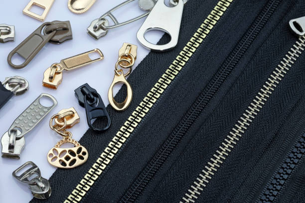 Zipper on a black fabric base with different color runners.