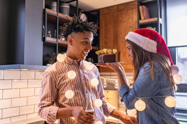 istock Young couple at home celebrating Christmas 1282893893