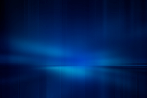 Blurred rays of light abstract blue background