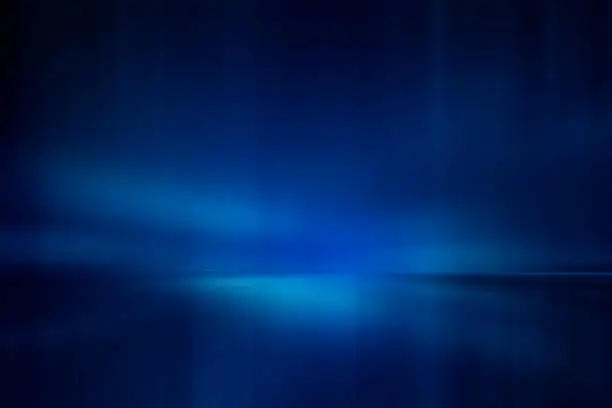 Photo of Blurred rays of light abstract blue background