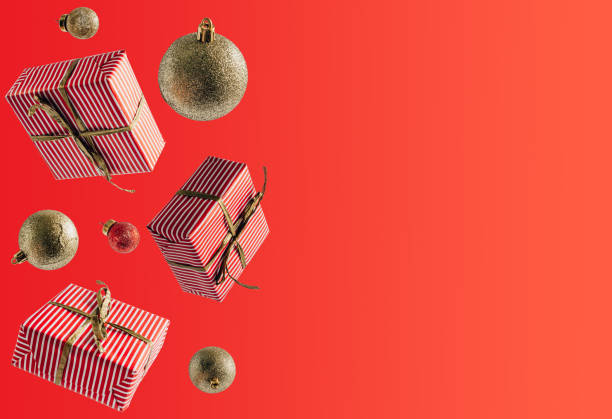 istock White Christmas gift boxes falling or flying in motion on beige background. 1282894814
