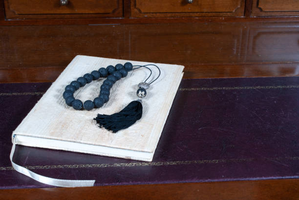 istock Worry beads on book on desk 1282894828