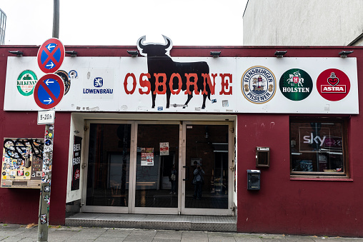 Hamburg, Germany - August 16, 2019: Osborne bar with beer advertising in St. Pauli, Hamburg, Germany
