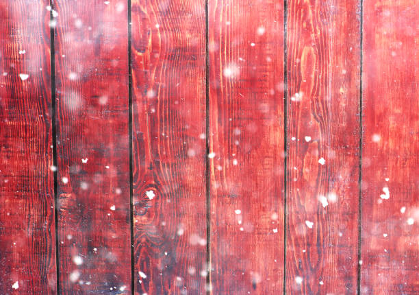 istock Wooden boards and glitter bokeh lights with snow. 1282898272