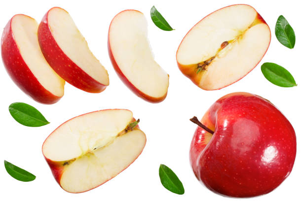 istock red apples with slices and green leaves isolated on a white background. top view 1282899687