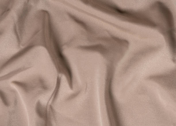 istock Textured nude fabric background Abstract background. Festive concept. 1282900534