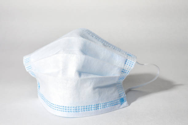 istock Medical mask on white background, disposable face mask for coronavirus protection. Selective focus 1282900735
