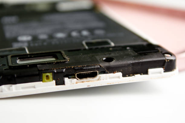 istock Disassembled old Smartphone, type of USB connector. 1282900928