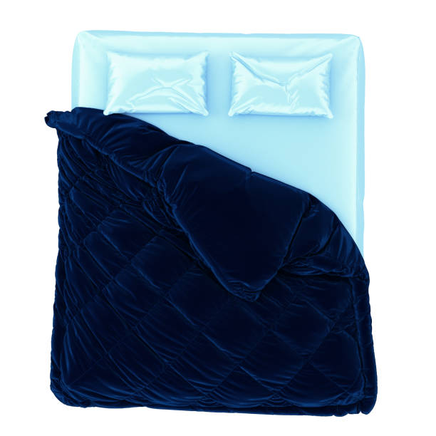 istock A mattress with two pillows and a blue blanket with folds on a white background. 3d rendering. 1282902026