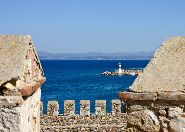 View of Bozcaada Island medieval castle and ships on aegean sea. Bozcaada island is a municipality and district governorate in Canakkale Province, Turkey. You see Bozcaada marina view from castle. And Tenedos Castle can be seen too from there.