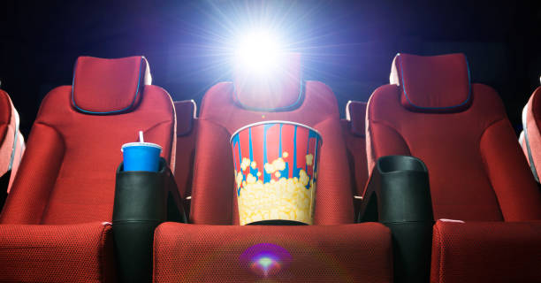 istock popcorn bucket on red theatre seat 1282904326