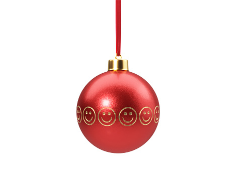Smiley faces etched red Christmas bauble tied with red velvet ribbon over white background. Clipping path included. Horizontal composition with copy space. Great use for Christmas related concepts.