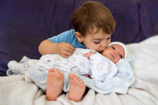 istock brother with newborn baby 1282906977