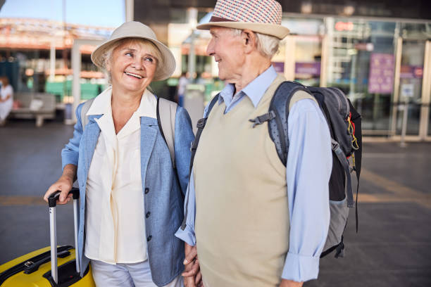 istock Happy senior lady smiling at a man 1282912843