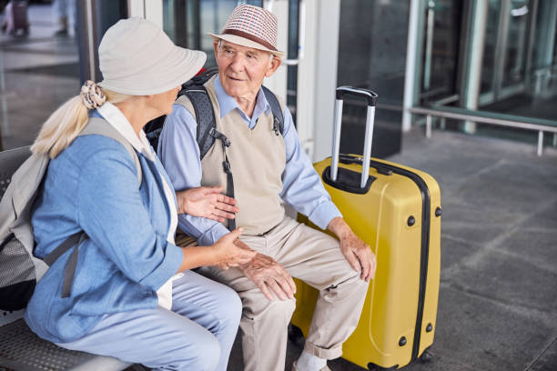 istock Two senior people having a conversation on the bench 1282912851