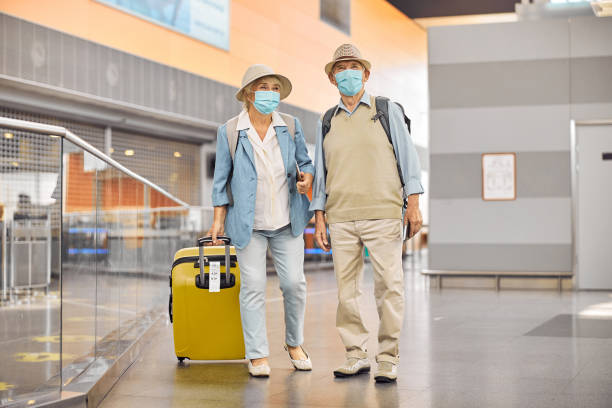 istock Two passengers standing at the airport terminal 1282912888