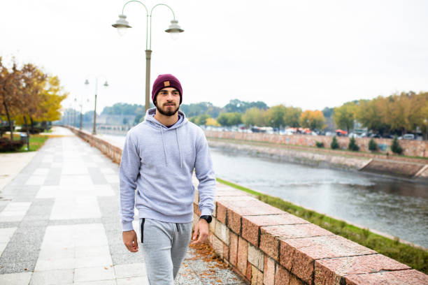 istock A good-looking man talking a walk by the river 1282913766