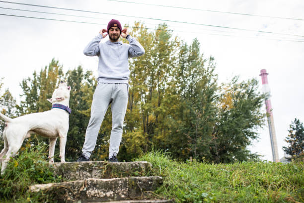 istock A good-looking man and his dog in a park 1282913780