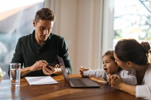 istock Young Caucasian father trying to work from home 1282914248