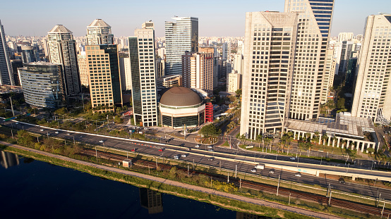 Aerial view of Marginal Pinheiros expressway and Pinheiros river in Sao Paulo city, Brazil. Traffic with few cars near Estaiada Bridge (Ponte Estaiada) on a sunny day.