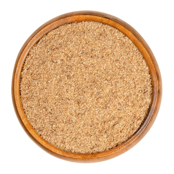 istock Freshly grated nutmeg, fragrant or true nutmeg, in a wooden bowl 1282916391