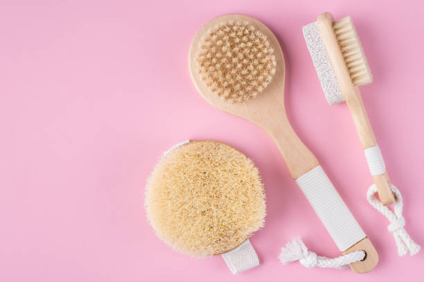 flat lay top above overhead close up view photo of massage brushs isolated on pastel color background with empty blank space - bristle brush part - fotografias e filmes do acervo