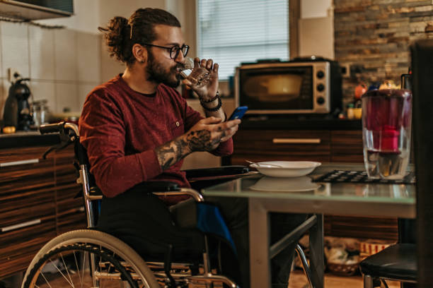 istock man sitting in a wheelchair at home 1282920025