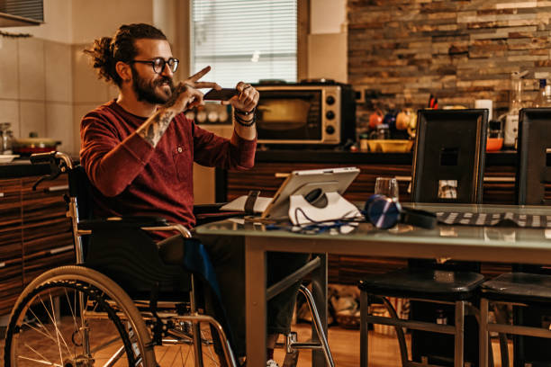 istock man sitting in a wheelchair at home 1282920119