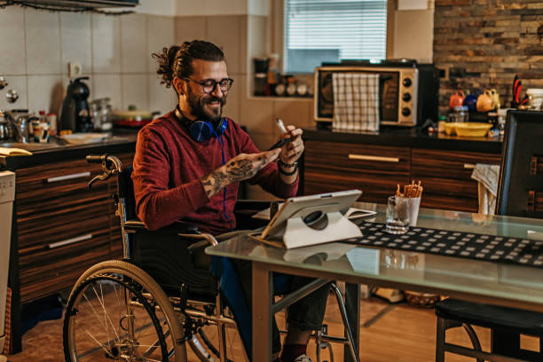 istock man sitting in a wheelchair at home 1282920134