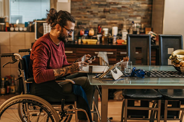 istock man sitting in a wheelchair at home 1282920163