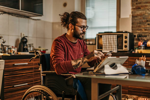 istock man sitting in a wheelchair at home 1282920184