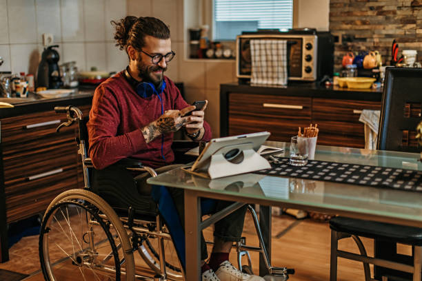 istock man sitting in a wheelchair at home 1282920190