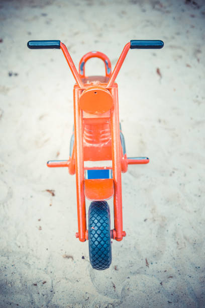 istock Toy motorbike in playground 1282921536