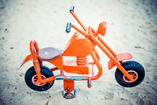 istock Toy motorbike in playground 1282921543