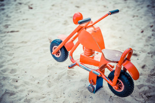 istock Toy motorbike in playground 1282921574