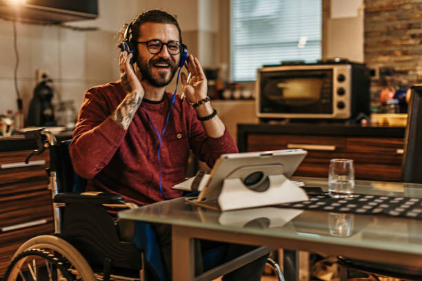 istock man sitting in a wheelchair at home 1282921603