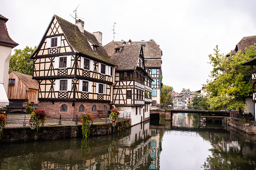 Outdoor scene with the canal and old architecture from the city of Strasbourg France