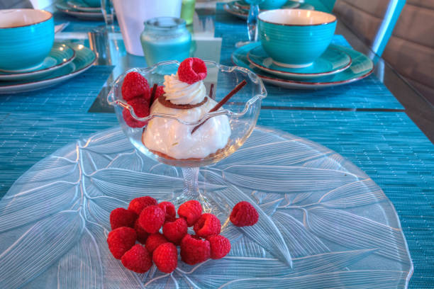 istock Dessert dish of cheesecake, shaved chocolate and raspberries 1282927205