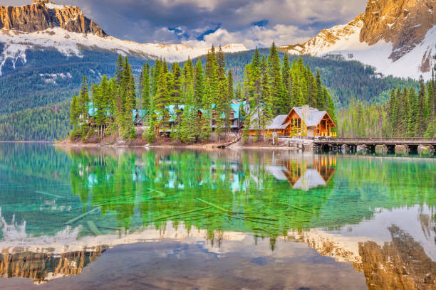 The Emerald Lake Lodge reflecting in Emerald Lake in Yoho National Park, near Field, British Columbia, Canada at sunset.